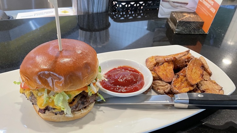 a burger and fries on a plate