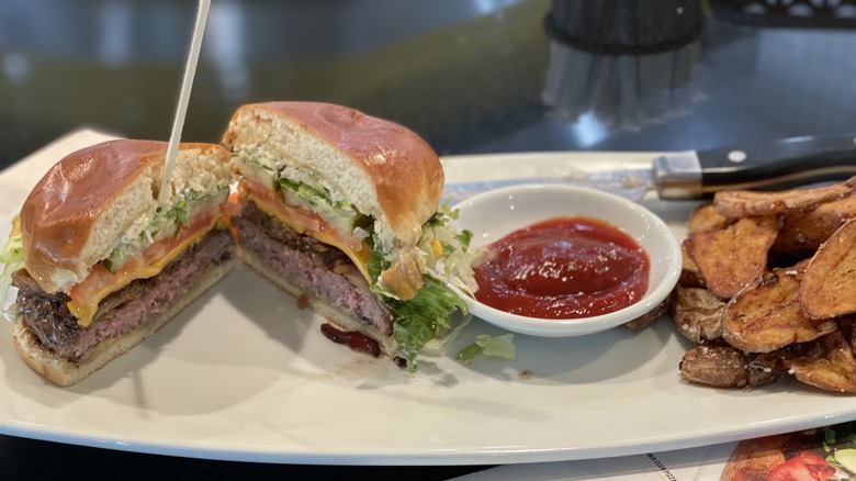 a sliced burger on a plate