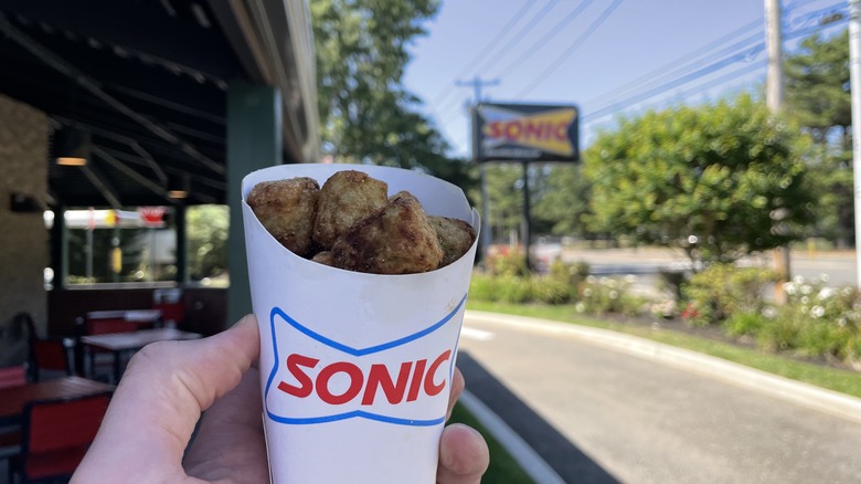 Sonic tots outside a Sonic