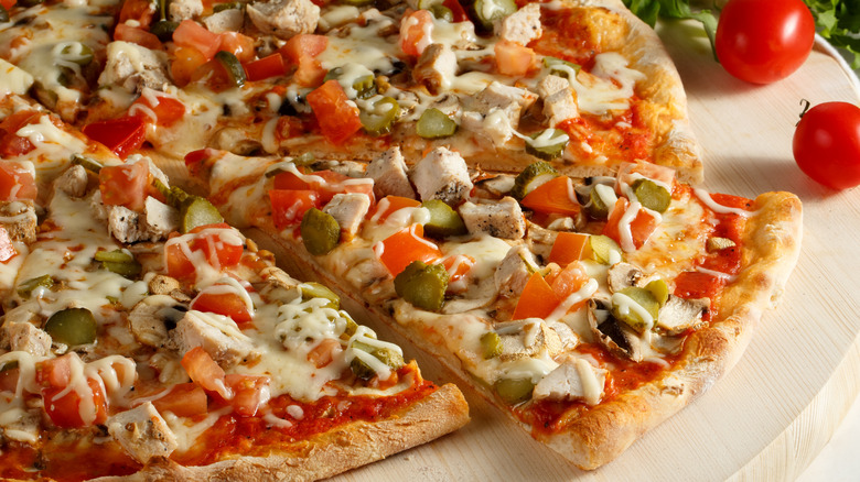 Pizza with pickles and other toppings