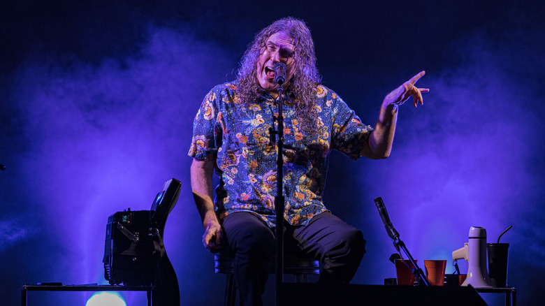 Weird Al Yankovic performing on stage