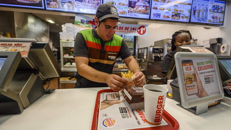 Burger King employees behind counter