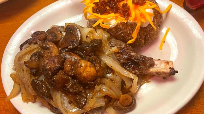 smothered steak and loaded potato