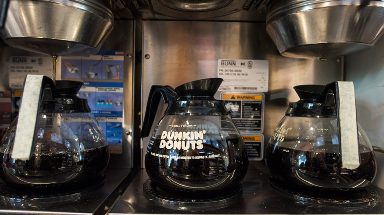 Three Dunkin' carafes