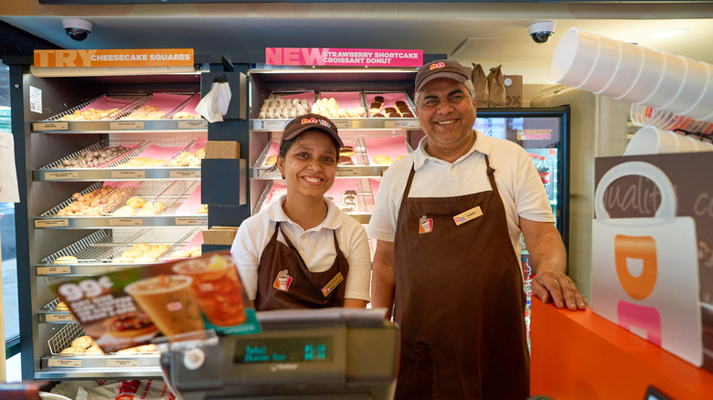 Dunkin' workers pose together