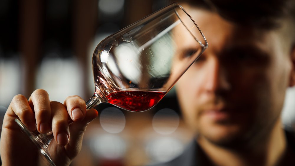 Swirling wine at a fancy restaurant