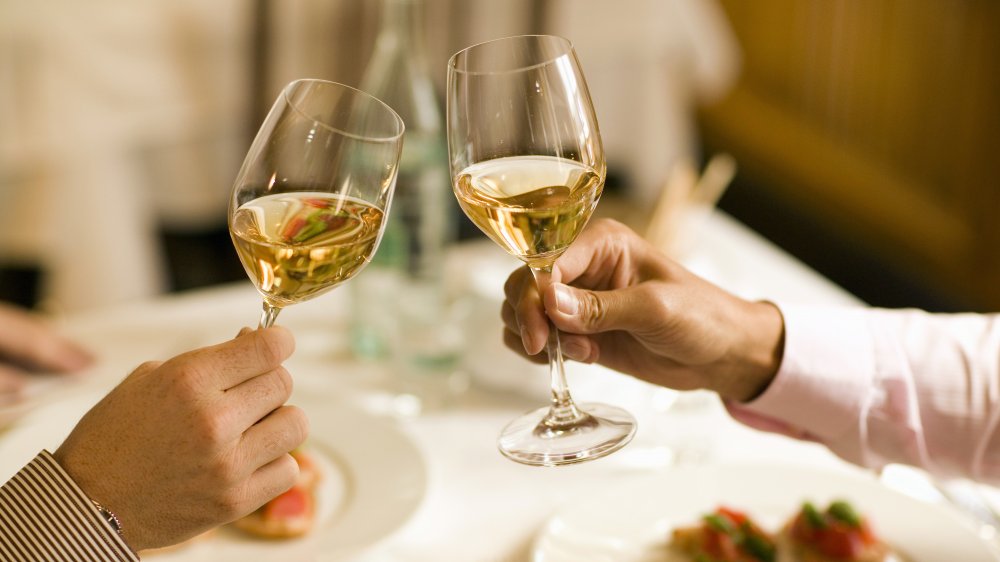 Toasting with wine at a fancy restaurant