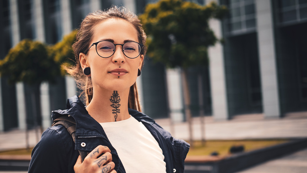 Woman with a neck tattoo