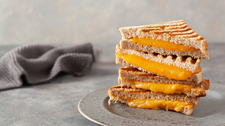 Grilled cheese sandwiches on gray plate