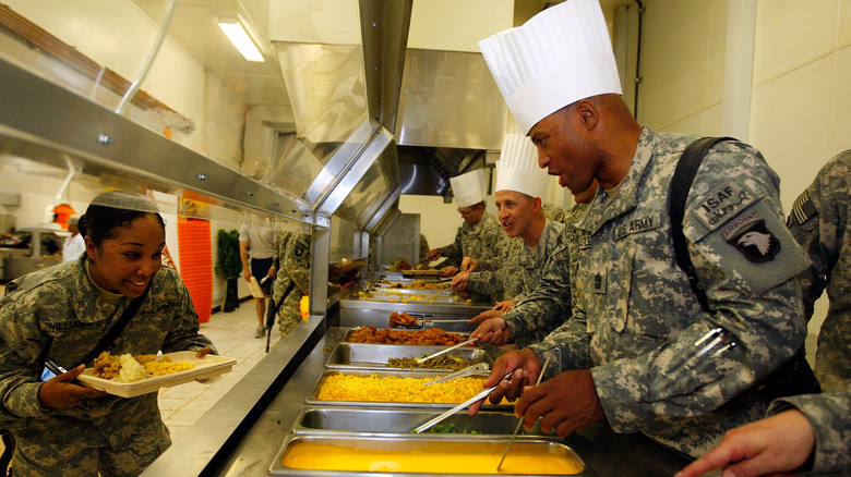 Army soldier choosing food at dining hall
