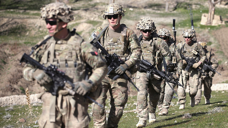 Army soldiers marching in gear