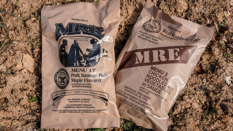 Packs of MREs on dirt