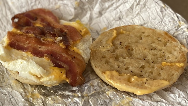 Opened Wendy's English muffin sandwich on wrapper