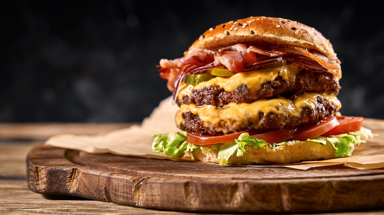 Cheeseburger on wood platter