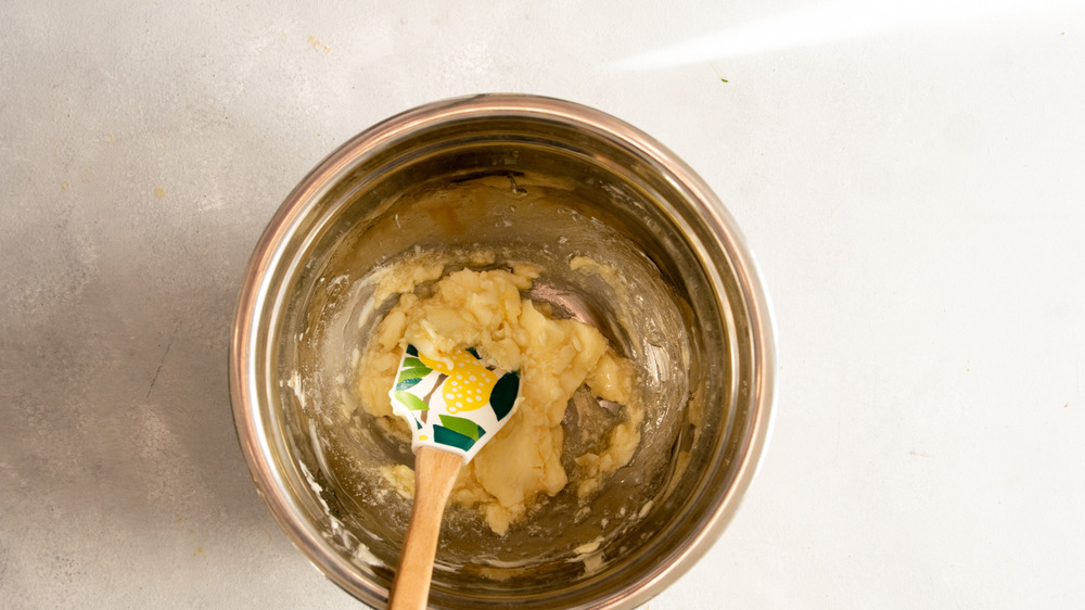 mixing butter, maple syrup, and honey in a bowl