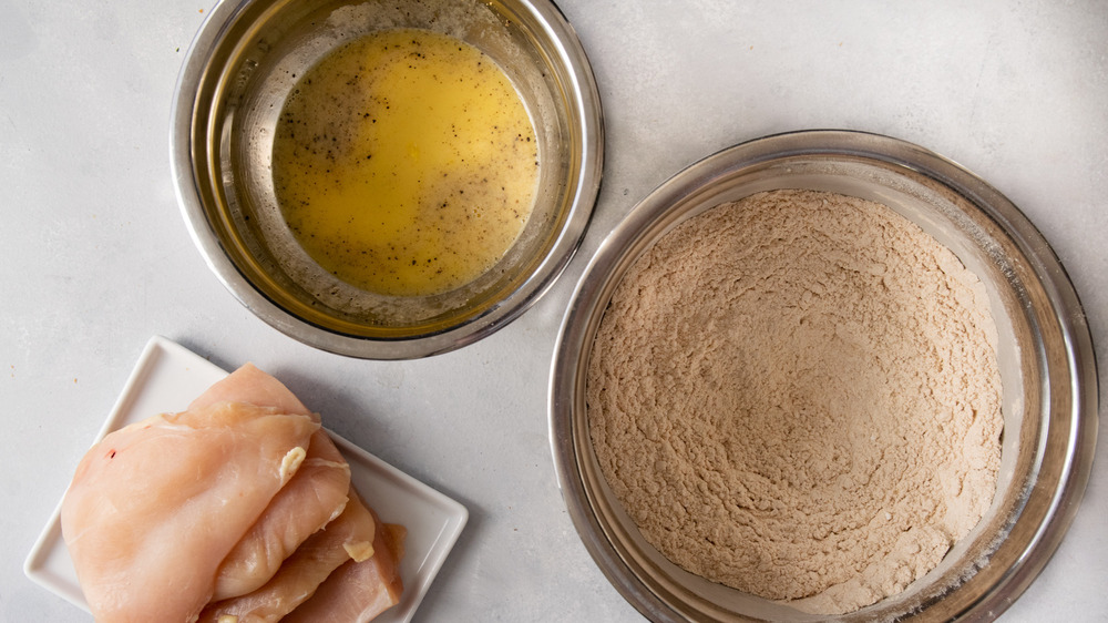 chicken breasts with egg wash and breading