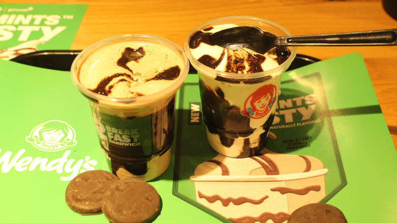 Two Wendy's Thin Mints Frosty treats and cookies on tray