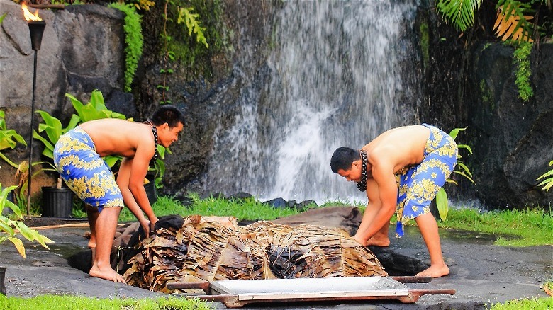 Men preparing Hawaiian imu