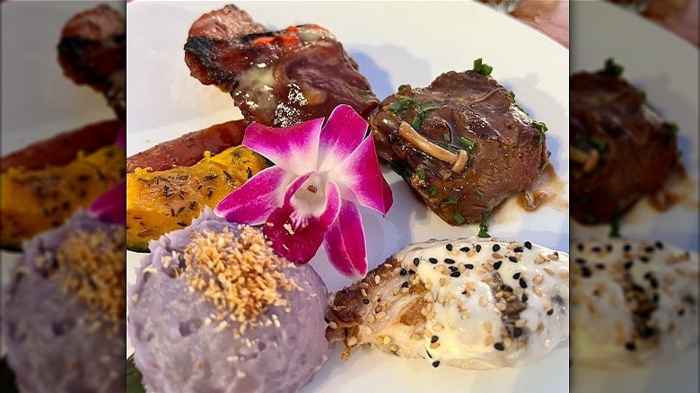 Hawaiian foods and meat on plate