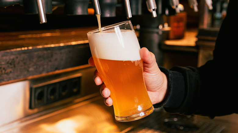 Pouring beer into glass