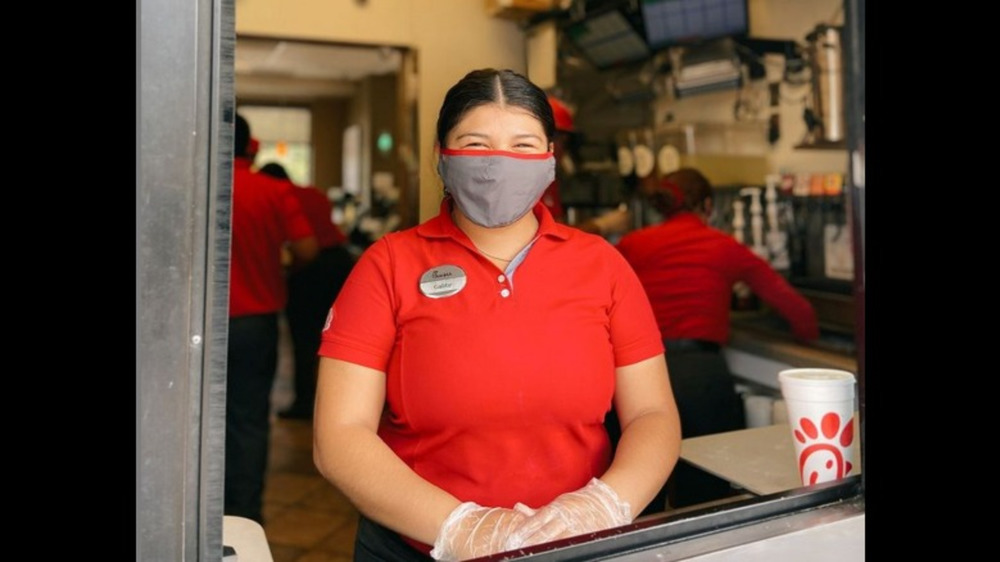 Chick-fil-A employee at drive-thru window