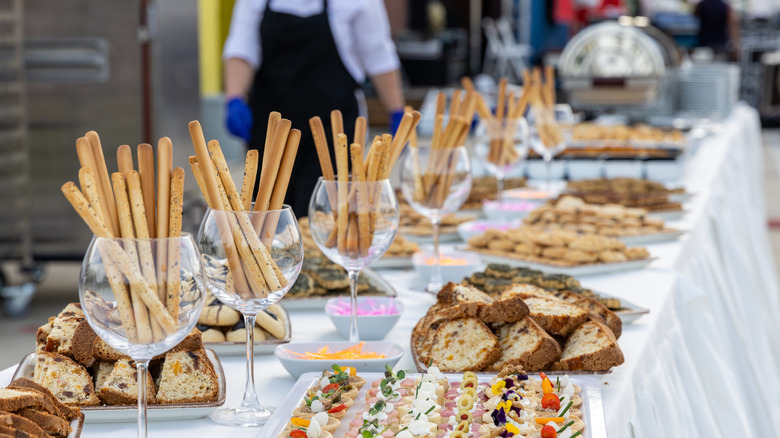 Bread and breadsticks on buffet table