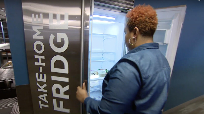 woman in front of refrigerator