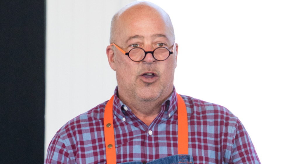 Andrew Zimmern in a checked shirt