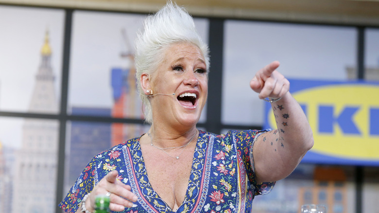 Anne Burrell wears blue printed dress and points