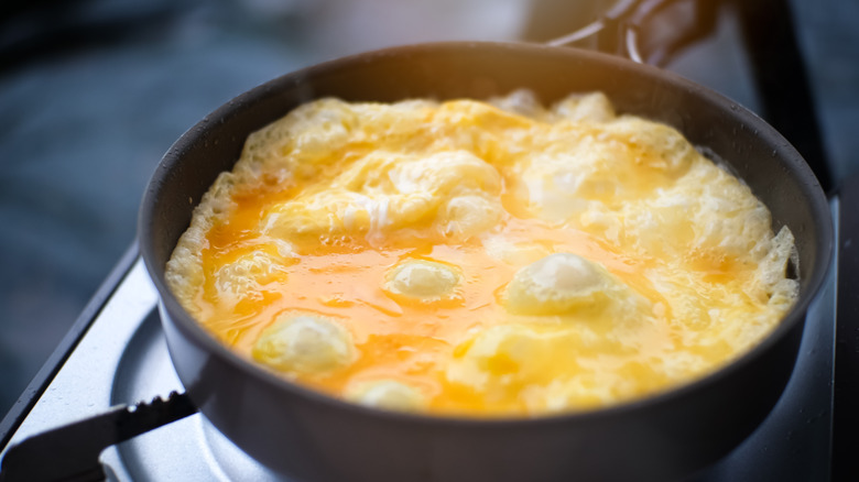 Eggs bubbling in pan