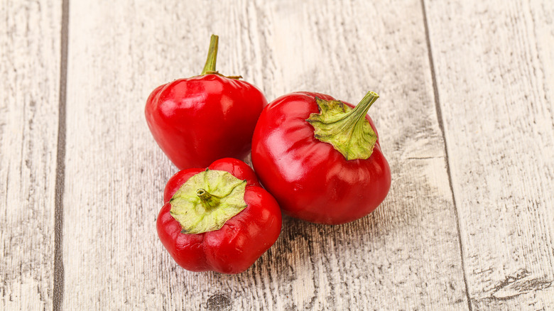 cherry peppers on light wood background