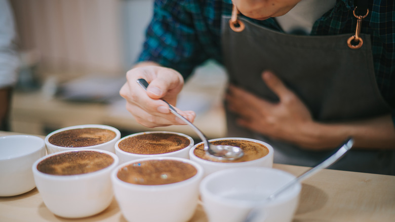 Person cupping coffee