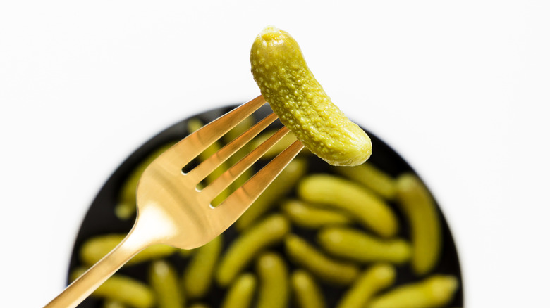 cornichon on fork