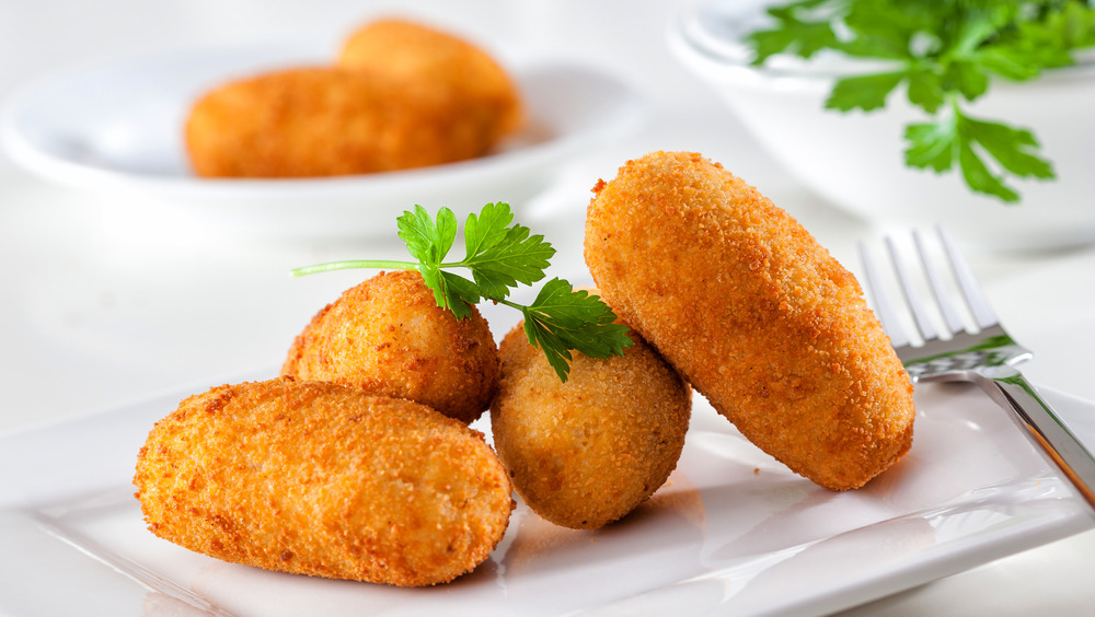 croquettes on dish with fork