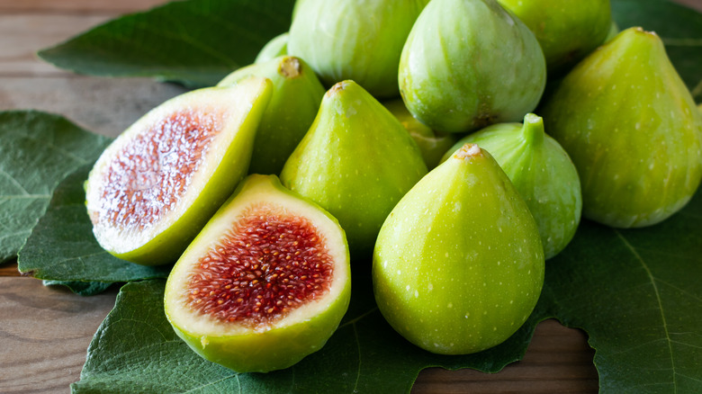 Green figs with leaves attached