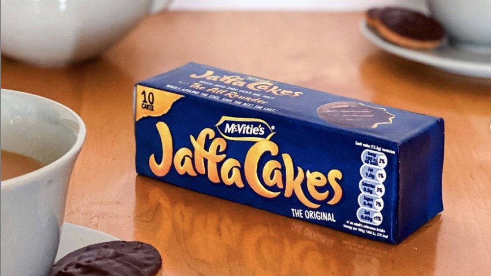 Jaffa cakes package on a table with tea 