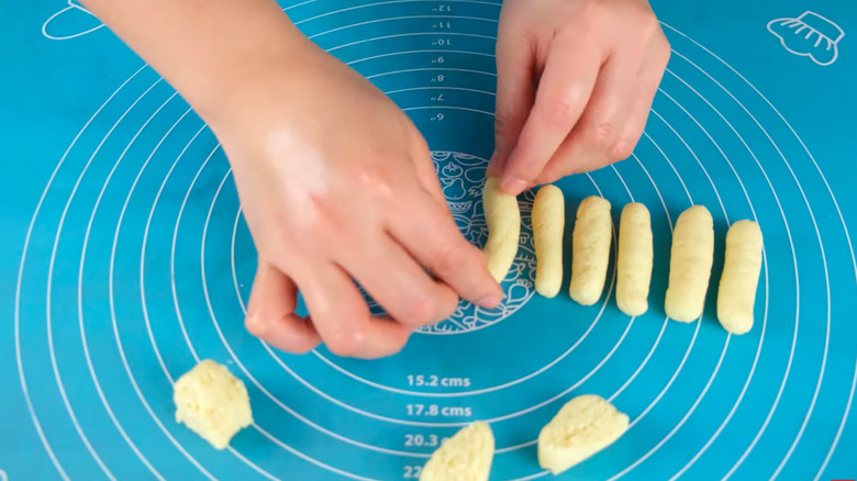 hands forming pastilla de leche dough