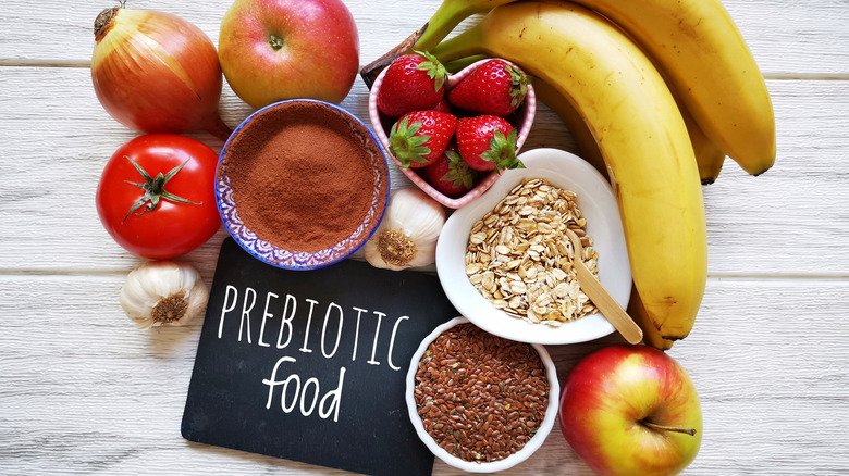 Prebiotic food label on table with fruits and grains