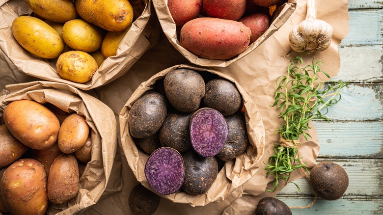 different types of potatoes in paper bags 