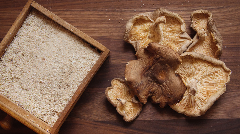 dried shiitakes on wooden background