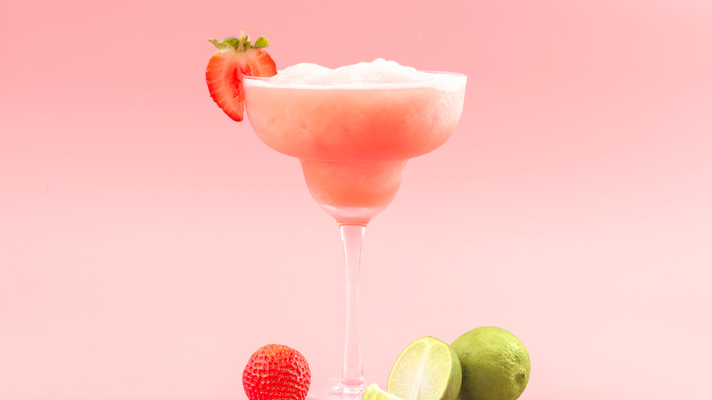 Icey strawberry margarita on pink background