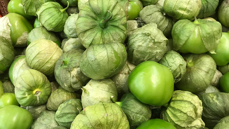 Piles of fresh green tomatillos