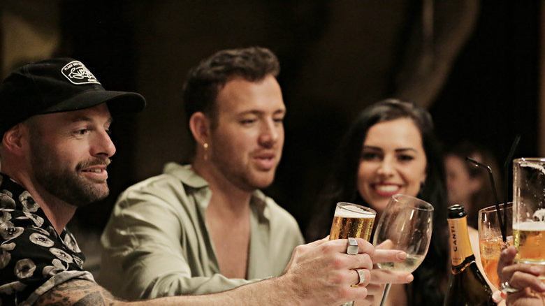 Dave White, Kyle Viljoen, and Natasha Webb toasting