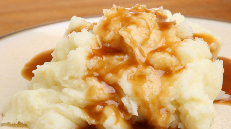 mashed potatoes covered in brown gravy