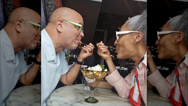 Carla Hall and husband sharing food