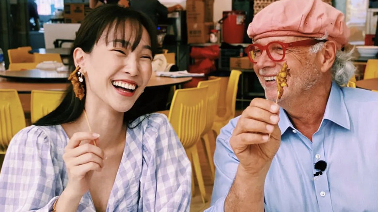 Francis Mallmann laughs with a friend