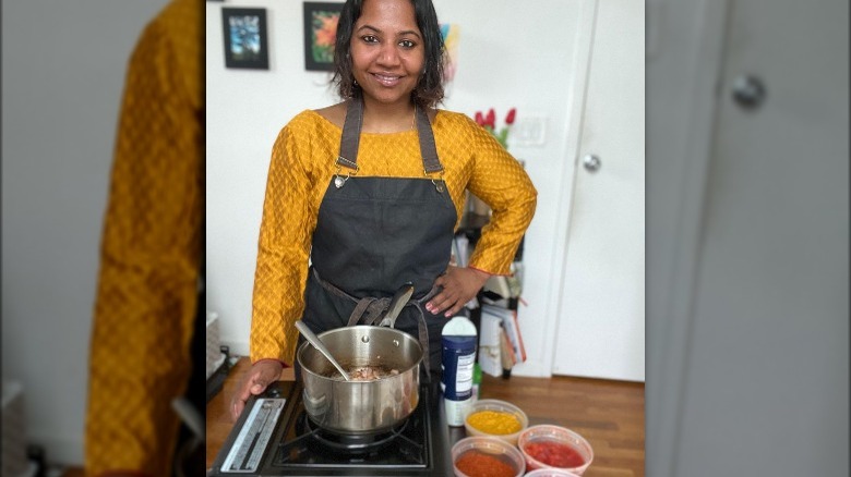 Aarthi Sampath posing in the kitchen