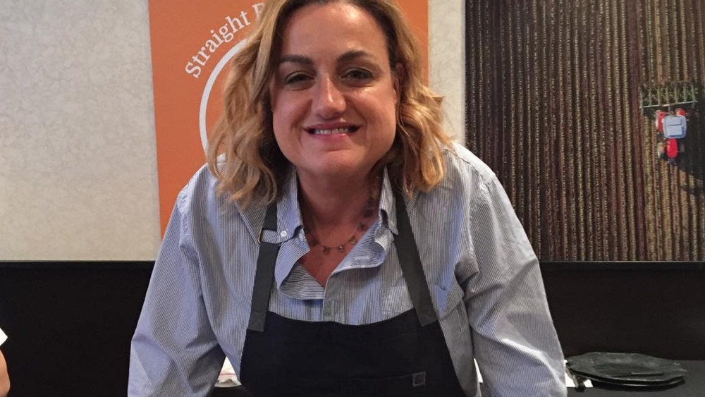 Silvia Baldini smiling at restaurant