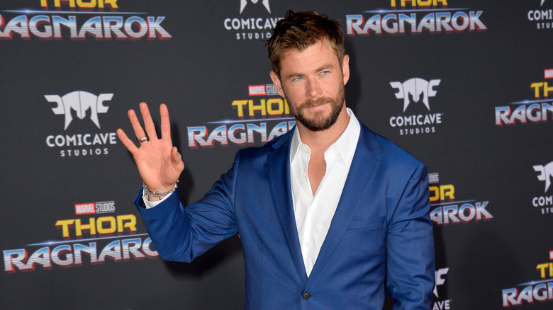 Chris Hemsworth waving on the red carpet