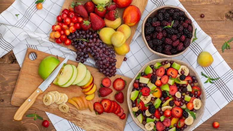 preparing diverse fruit salad